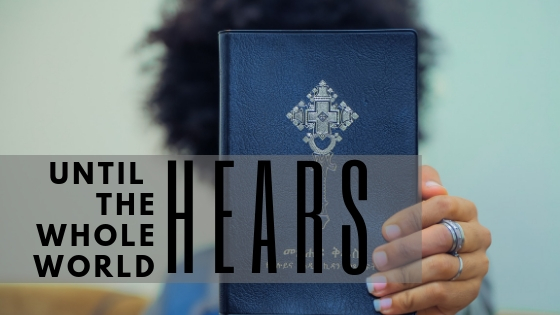 Until the Whole World Hears - lady holding a Bible
